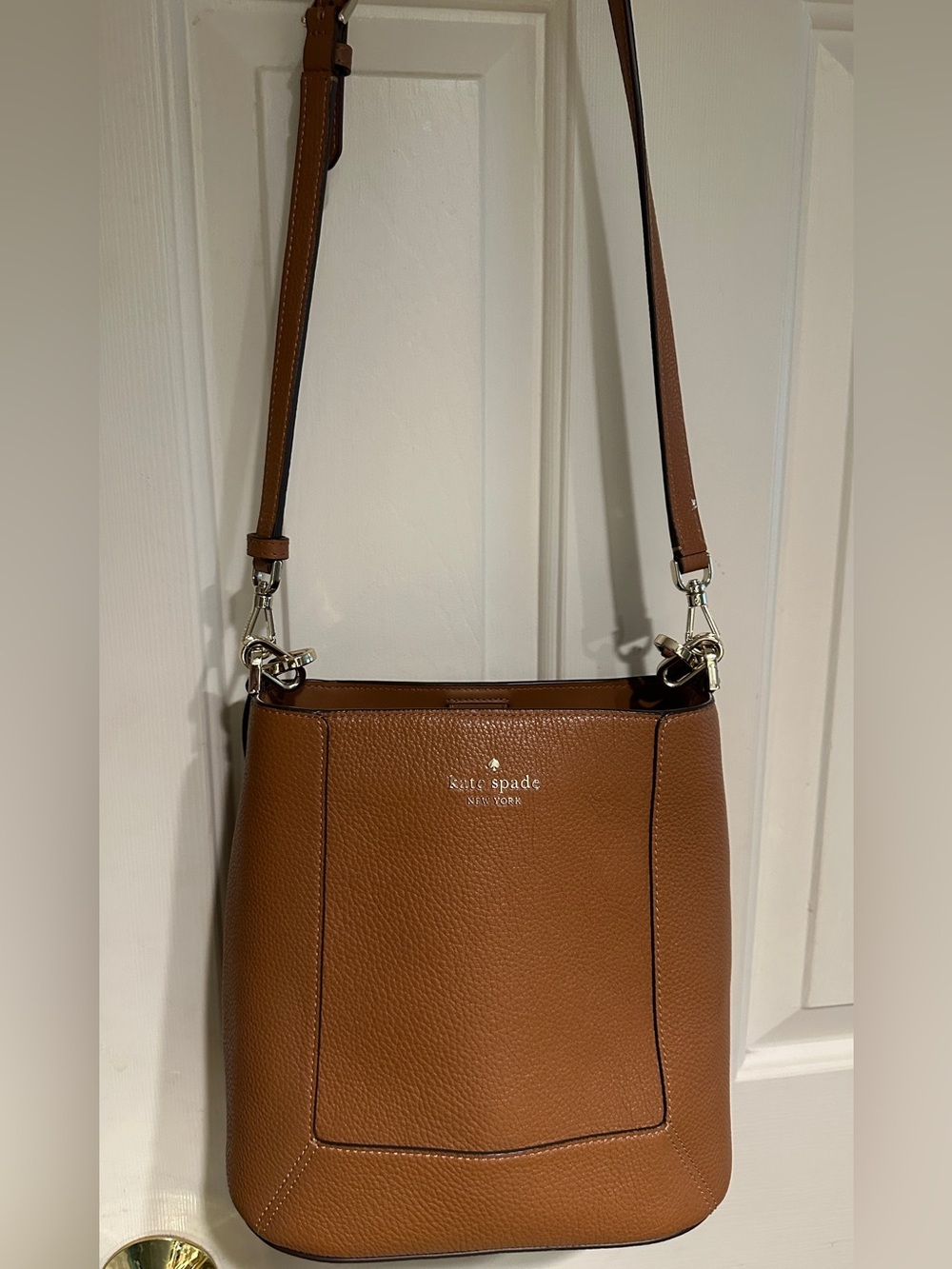 Barely carried, chestnut colored, Kate Spade crossbody with top handle
